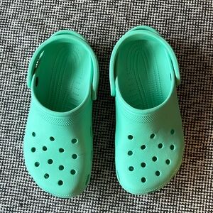 Teal Crocs classic croc clog style